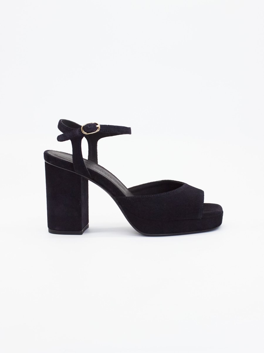 Black heels for women featuring a block heel, platform sole, and ankle strap with a gold buckle.