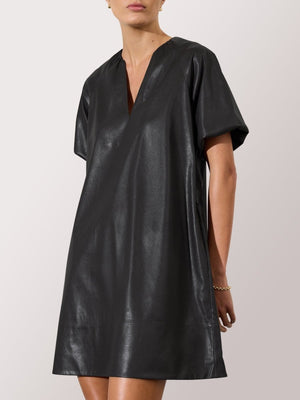 Women's black leather dress with short sleeves, V-neckline, and a loose, minimalist silhouette.