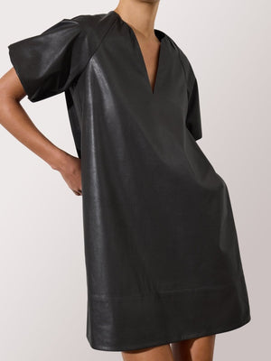 Women's faux black leather dress with short sleeves, a relaxed fit, and a deep V-neckline.