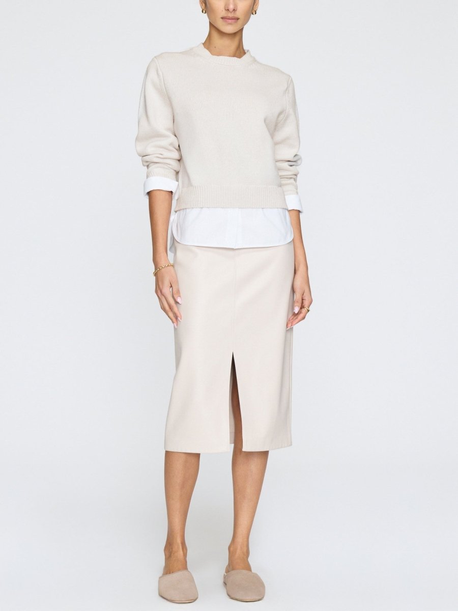 Womens long sleeve crewneck sweater in soft knit layered over white shirt