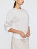 Womens white crewneck sweater with long sleeves and relaxed fit