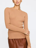 Women's ribbed sweater in camel with long sleeves and a fitted silhouette paired with a brown leather skirt.
