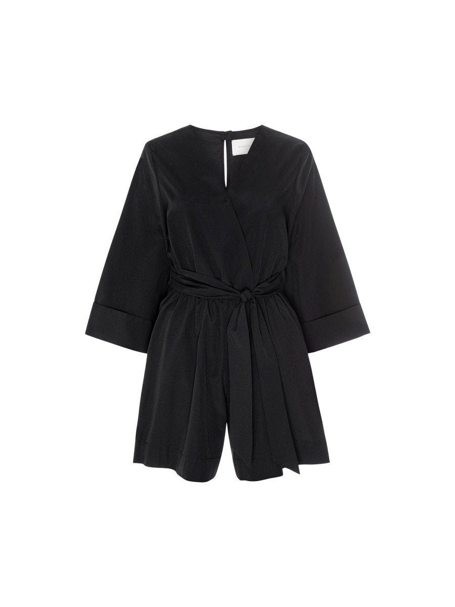 Women's black romper dress with a belted waist, wide sleeves, and front wrap-style detailing for a chic minimalist look.
