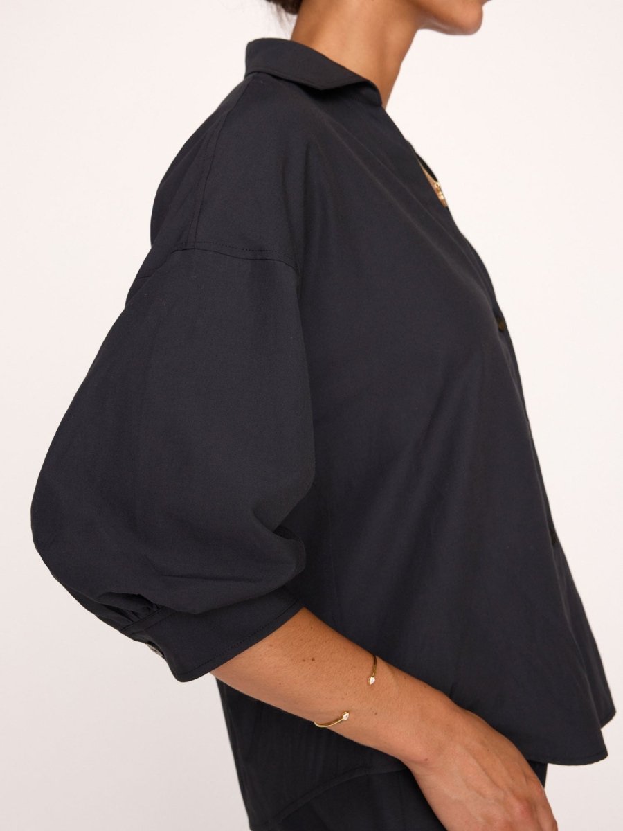 Kate V-neck button up black shirt side view