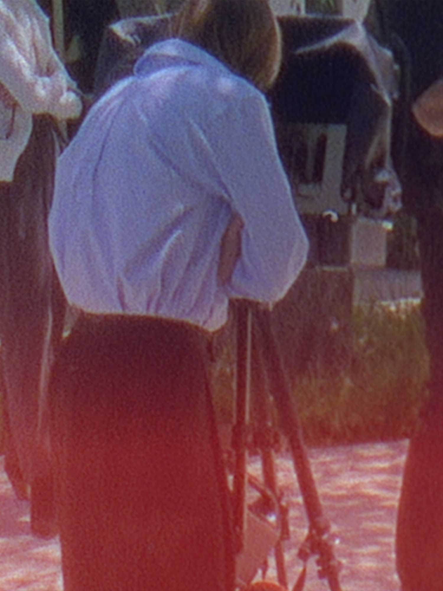 BTS of a woman looking into the camera for a shoot for brochu walker