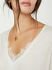 White lace layered v-neck sweater close up