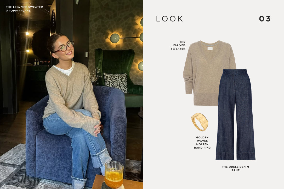 Relaxed, casual look featuring a beige V-neck sweater, dark denim wide-leg pants, and a gold statement ring for a polished yet cozy outfit.